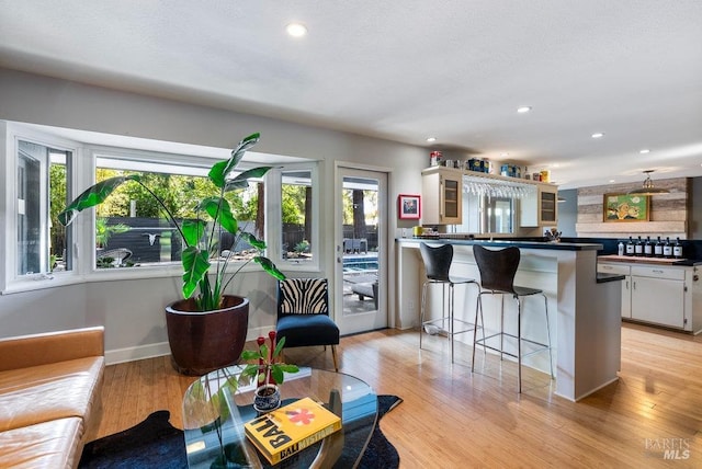 interior space featuring recessed lighting, baseboards, and light wood-style flooring