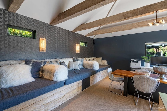 carpeted bedroom with wallpapered walls, an inviting chandelier, vaulted ceiling with beams, and an accent wall