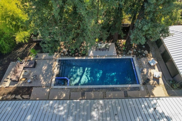 outdoor pool featuring a patio area