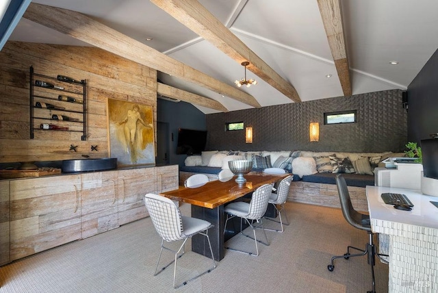 dining space featuring carpet and vaulted ceiling with beams