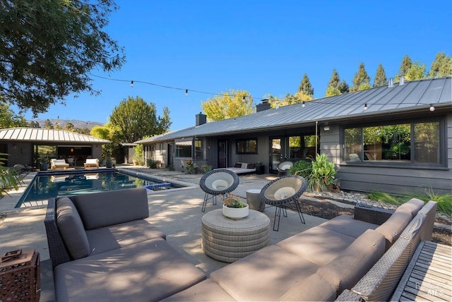 exterior space with a patio area and an outdoor living space