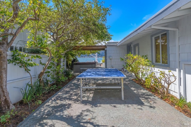 view of patio / terrace featuring a hot tub