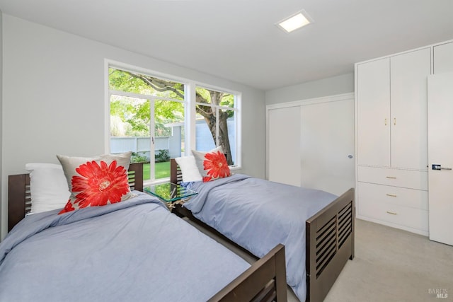 bedroom featuring light colored carpet