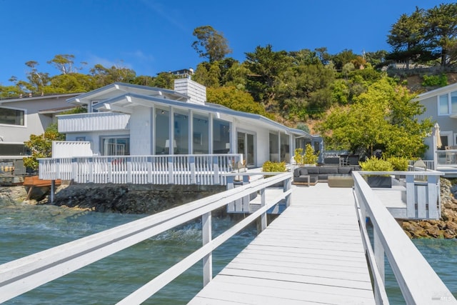 back of house with a water view