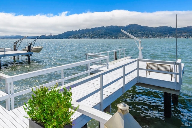 dock area featuring a water and mountain view