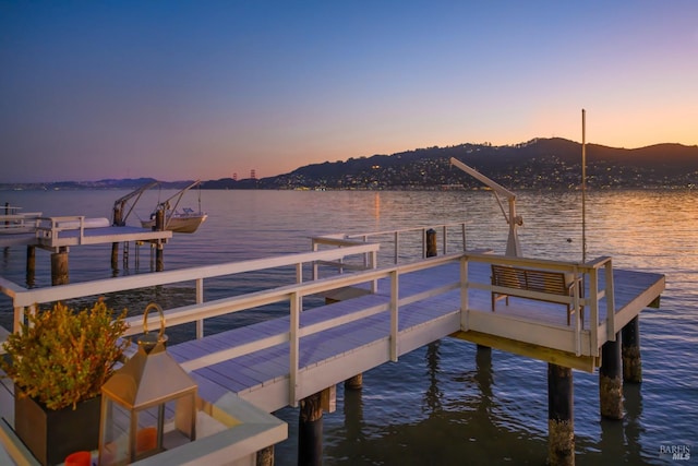 dock area with a water and mountain view