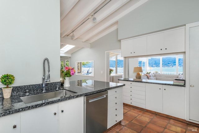 kitchen with lofted ceiling with beams, dishwasher, white cabinetry, and sink