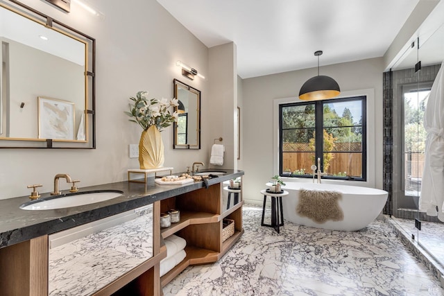 bathroom featuring a bath and vanity