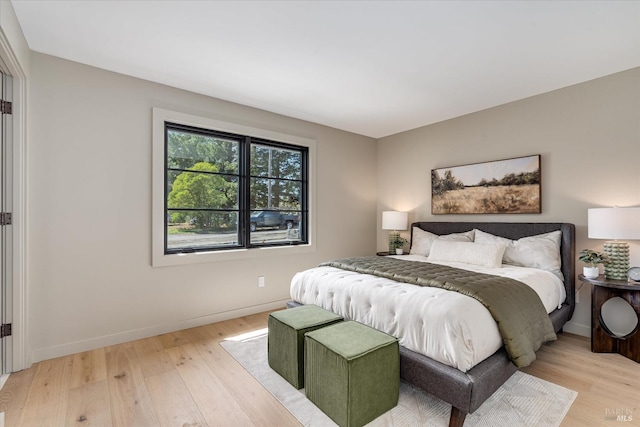 bedroom with light hardwood / wood-style flooring