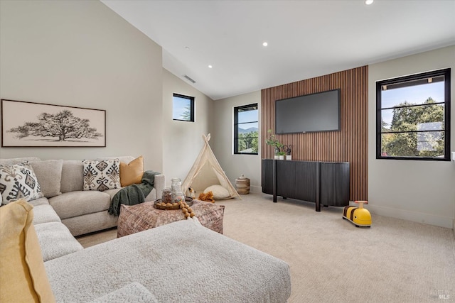 living room with carpet flooring and lofted ceiling