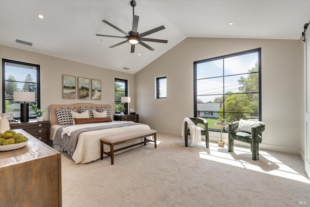 bedroom with light colored carpet, ceiling fan, and lofted ceiling