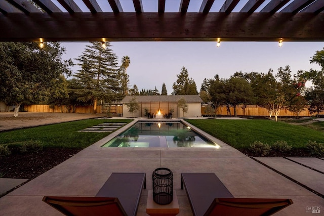 pool at dusk with a lawn