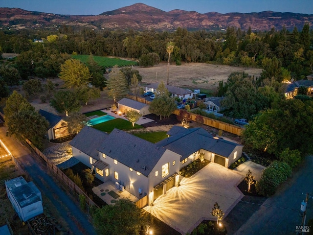 birds eye view of property with a mountain view