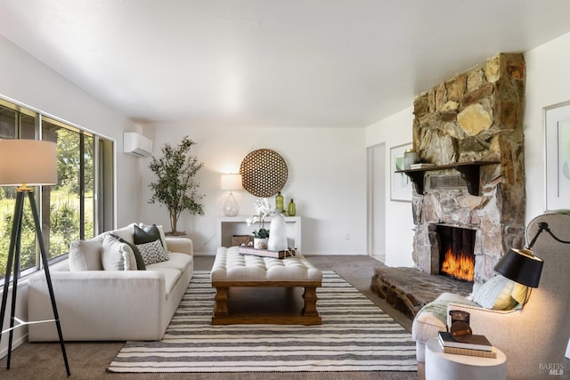 carpeted living room featuring a wall mounted air conditioner and a fireplace