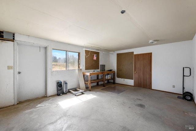 interior space with concrete flooring and a workshop area