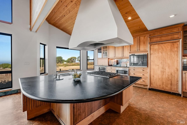 kitchen featuring wooden ceiling, premium range hood, and a spacious island