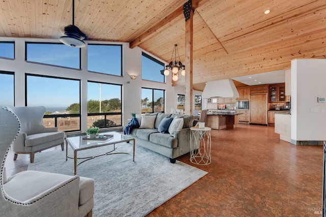 living room featuring beam ceiling, wood ceiling, high vaulted ceiling, and a chandelier