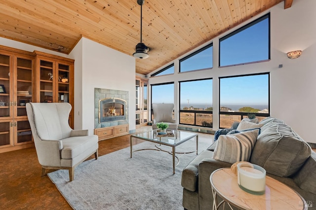 living room with wood ceiling, beam ceiling, a tiled fireplace, and high vaulted ceiling