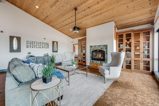 carpeted living room featuring high vaulted ceiling, a tile fireplace, and wooden ceiling