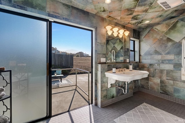 bathroom featuring tile walls and a mountain view