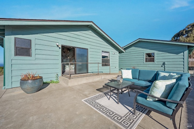 rear view of house with an outdoor hangout area and a patio