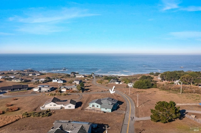 birds eye view of property with a water view and a residential view