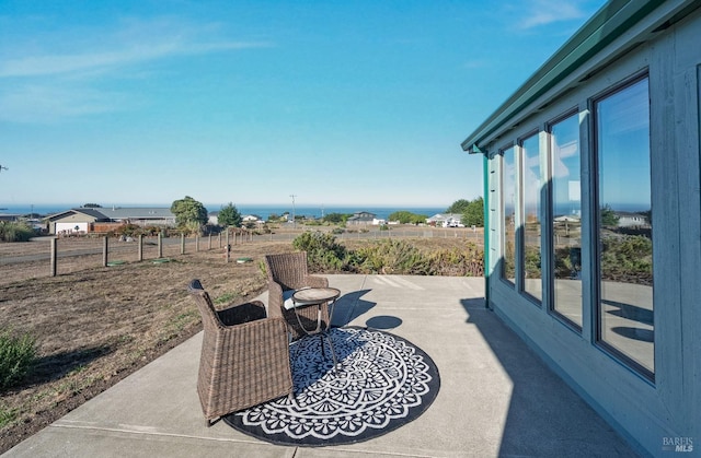 view of patio / terrace featuring a water view