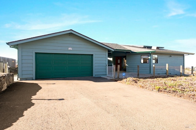 single story home featuring a garage