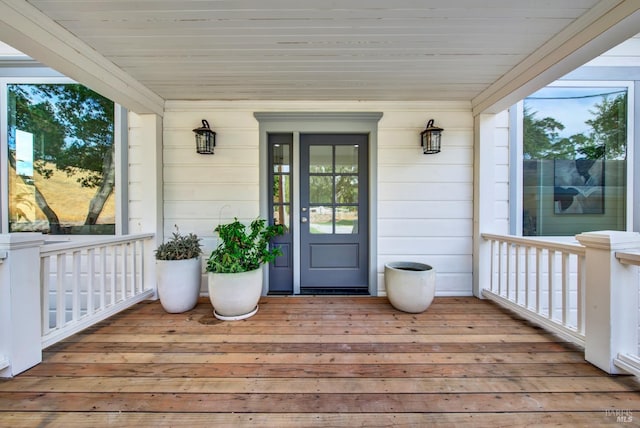 view of exterior entry featuring a porch