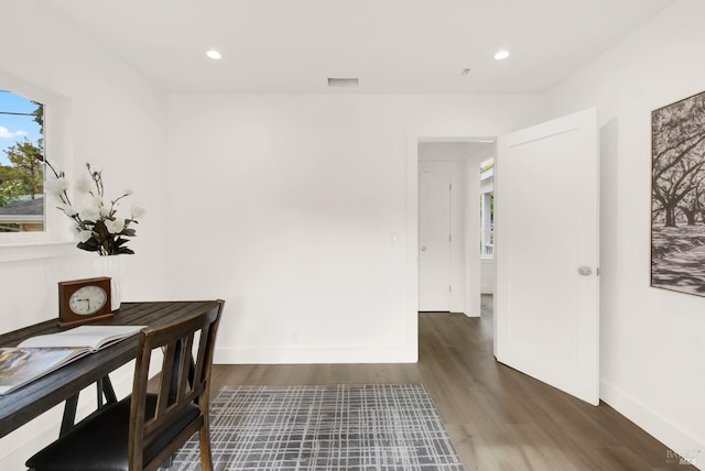 dining area featuring dark hardwood / wood-style floors