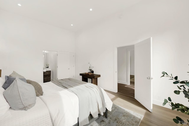 bedroom with light hardwood / wood-style floors