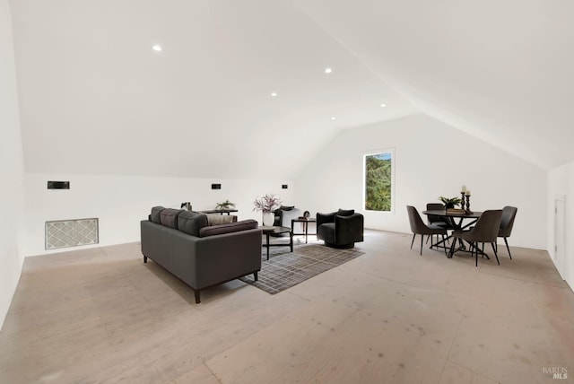 living area featuring vaulted ceiling and visible vents