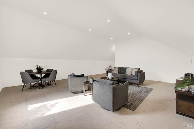 living room featuring lofted ceiling