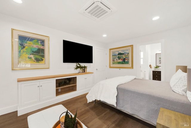 bedroom featuring visible vents, recessed lighting, ensuite bathroom, and dark wood finished floors