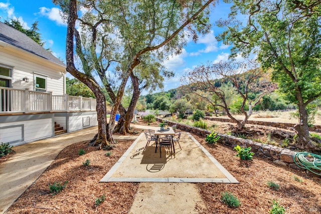 view of yard featuring a mountain view and a patio area