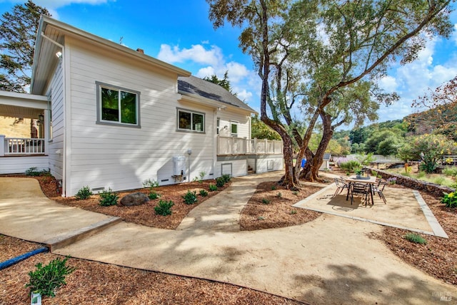 back of house with a patio area