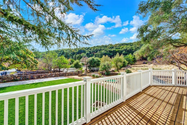 wooden terrace with a yard