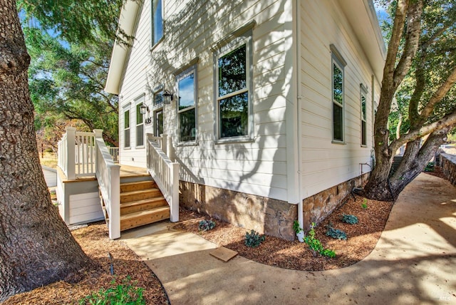 view of side of property featuring a deck