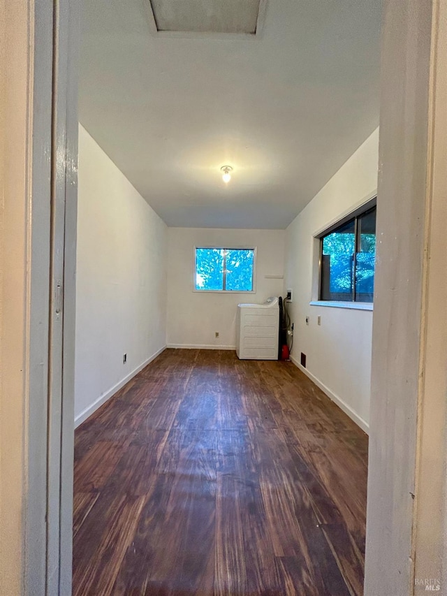 interior space featuring dark hardwood / wood-style flooring and a healthy amount of sunlight