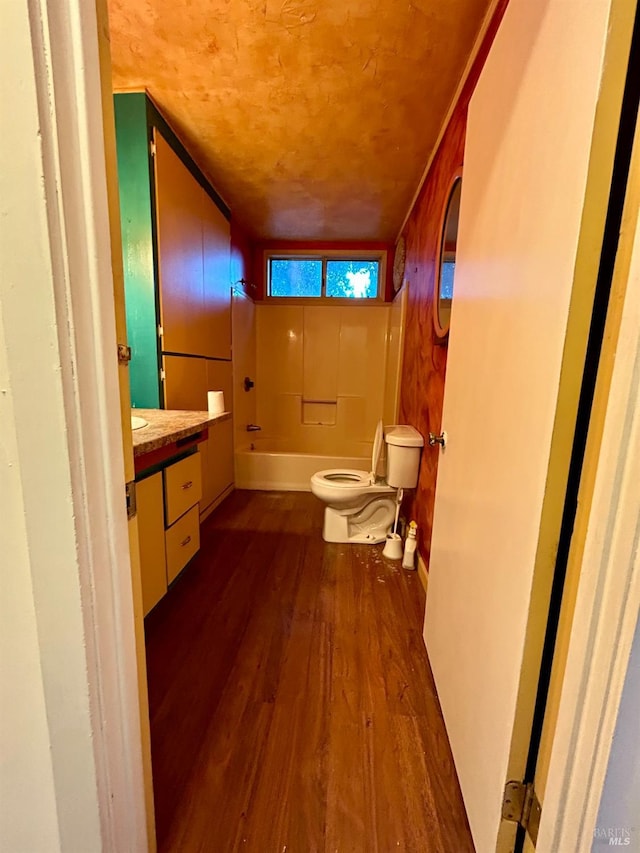 full bathroom featuring shower / bathing tub combination, vanity, toilet, and hardwood / wood-style flooring