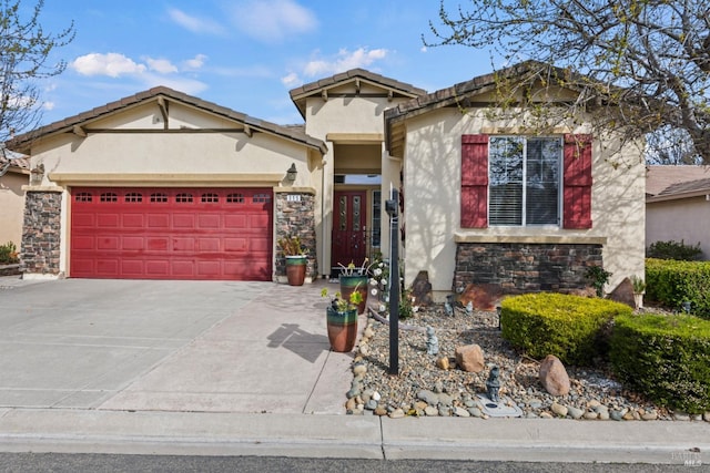 view of front of home featuring stone siding, an attached garage, driveway, and stucco siding