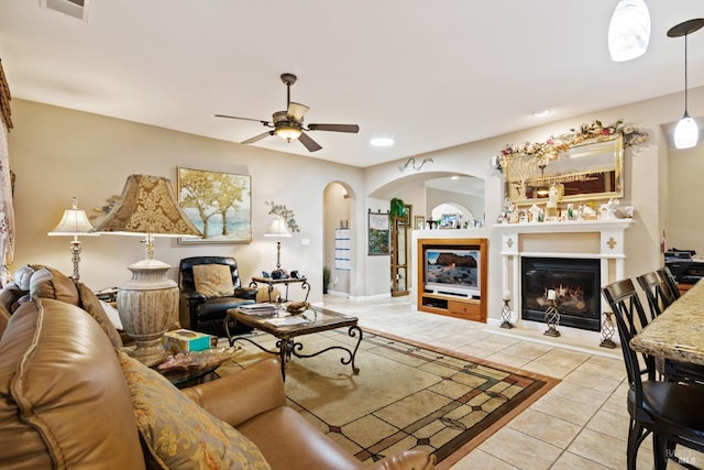 living room featuring ceiling fan and light tile patterned flooring