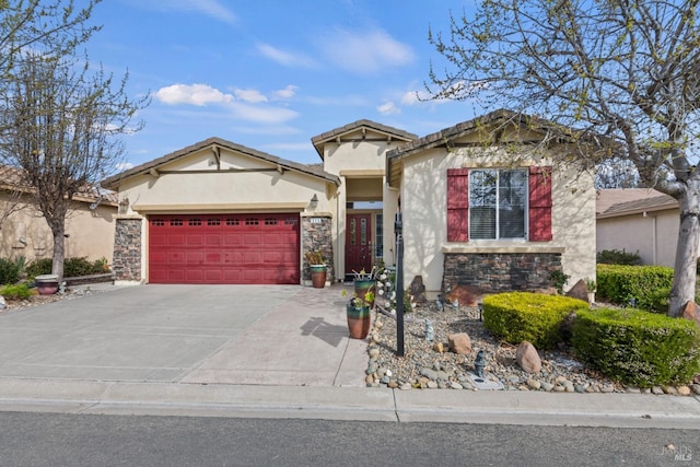 view of front of house featuring a garage, stone siding, concrete driveway, and stucco siding