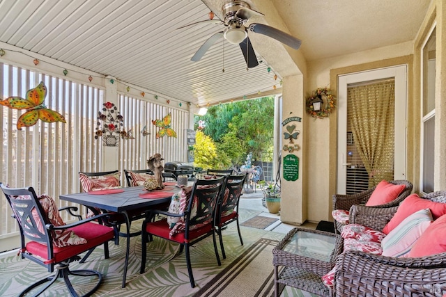 view of patio / terrace with outdoor dining space, an outdoor living space, and a ceiling fan