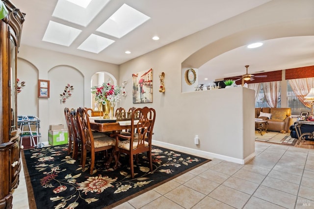 tiled dining area featuring ceiling fan