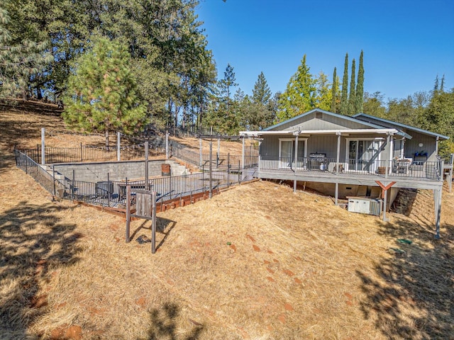 view of yard with a wooden deck