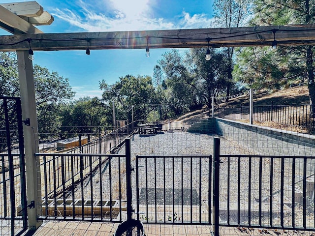 view of gate featuring fence