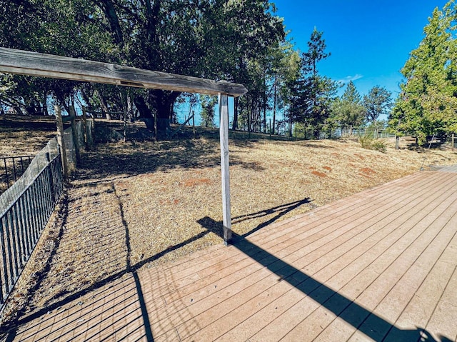 wooden deck featuring fence