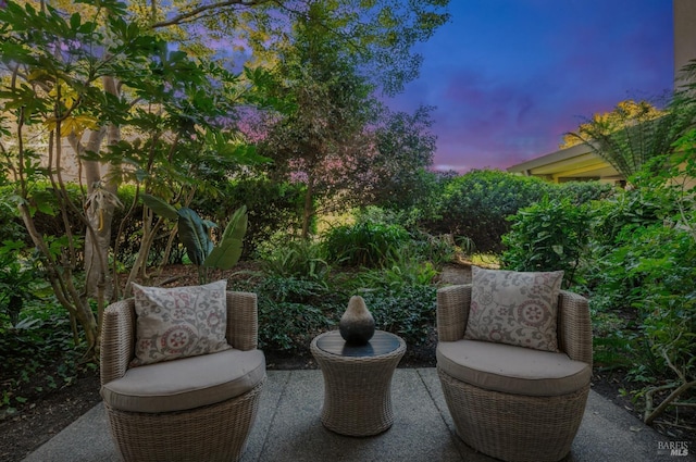 view of patio terrace at dusk