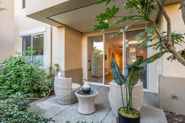 entrance to property with a patio area